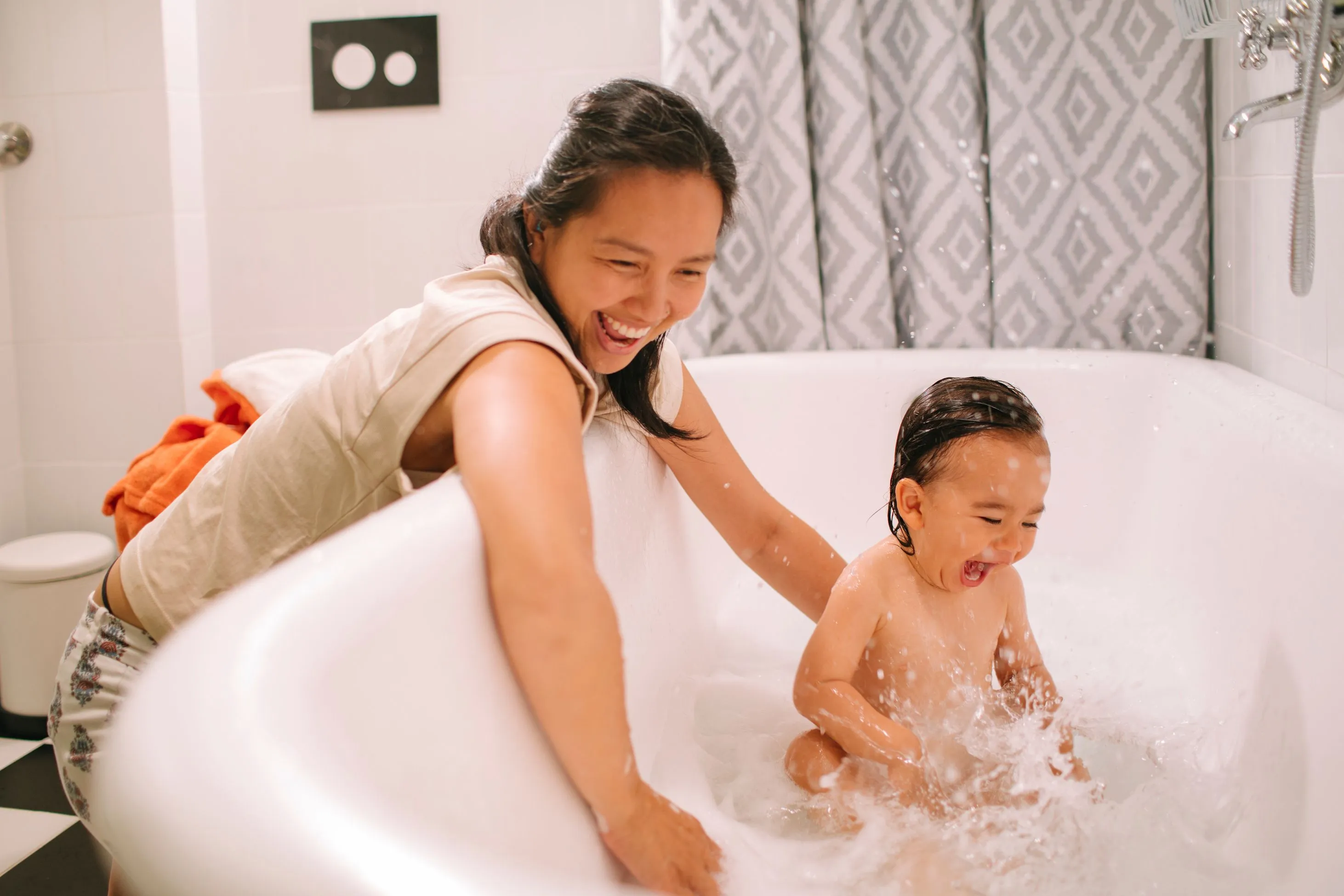 Mother and child bath time fun