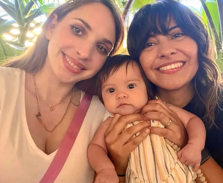 Happy LGBTQ couple and baby