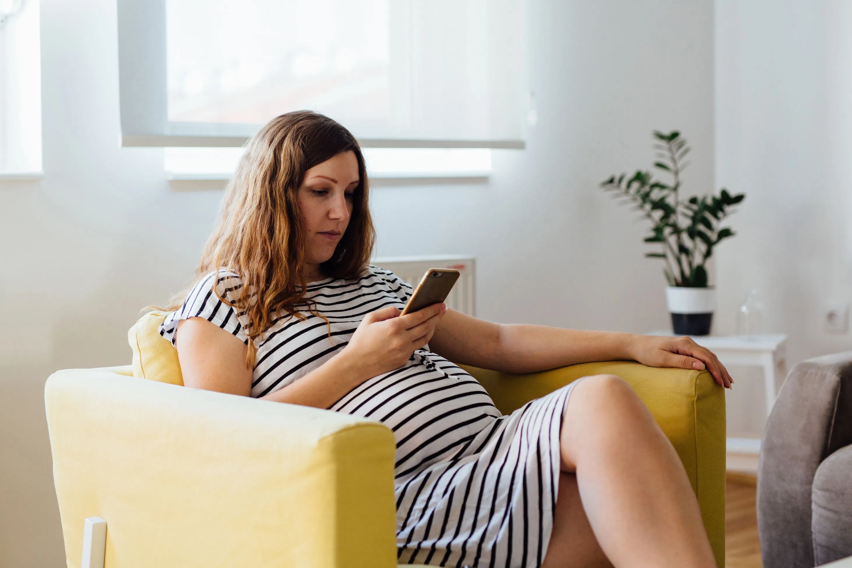 Pregnant woman on phone