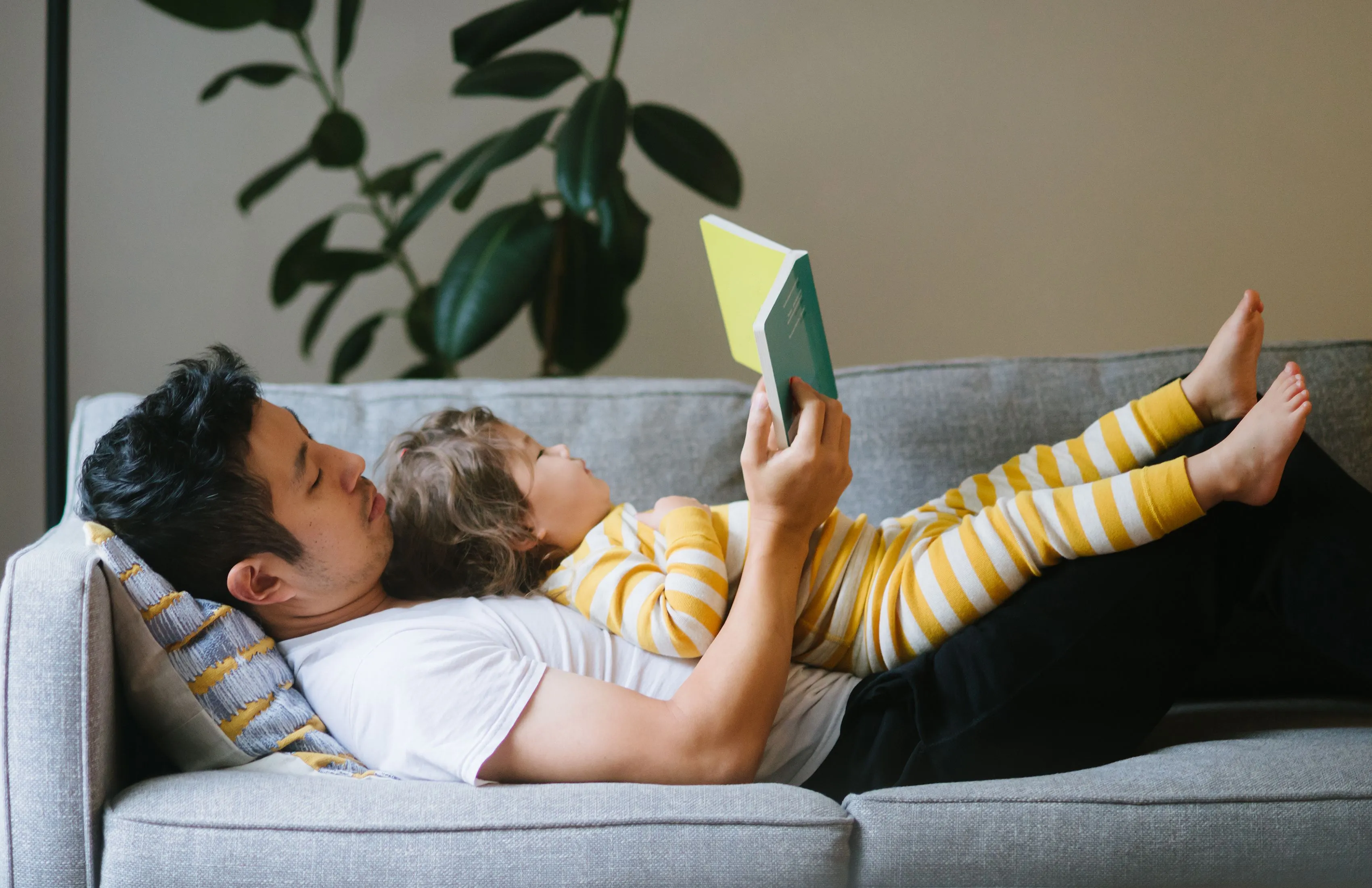 Baby and father reading