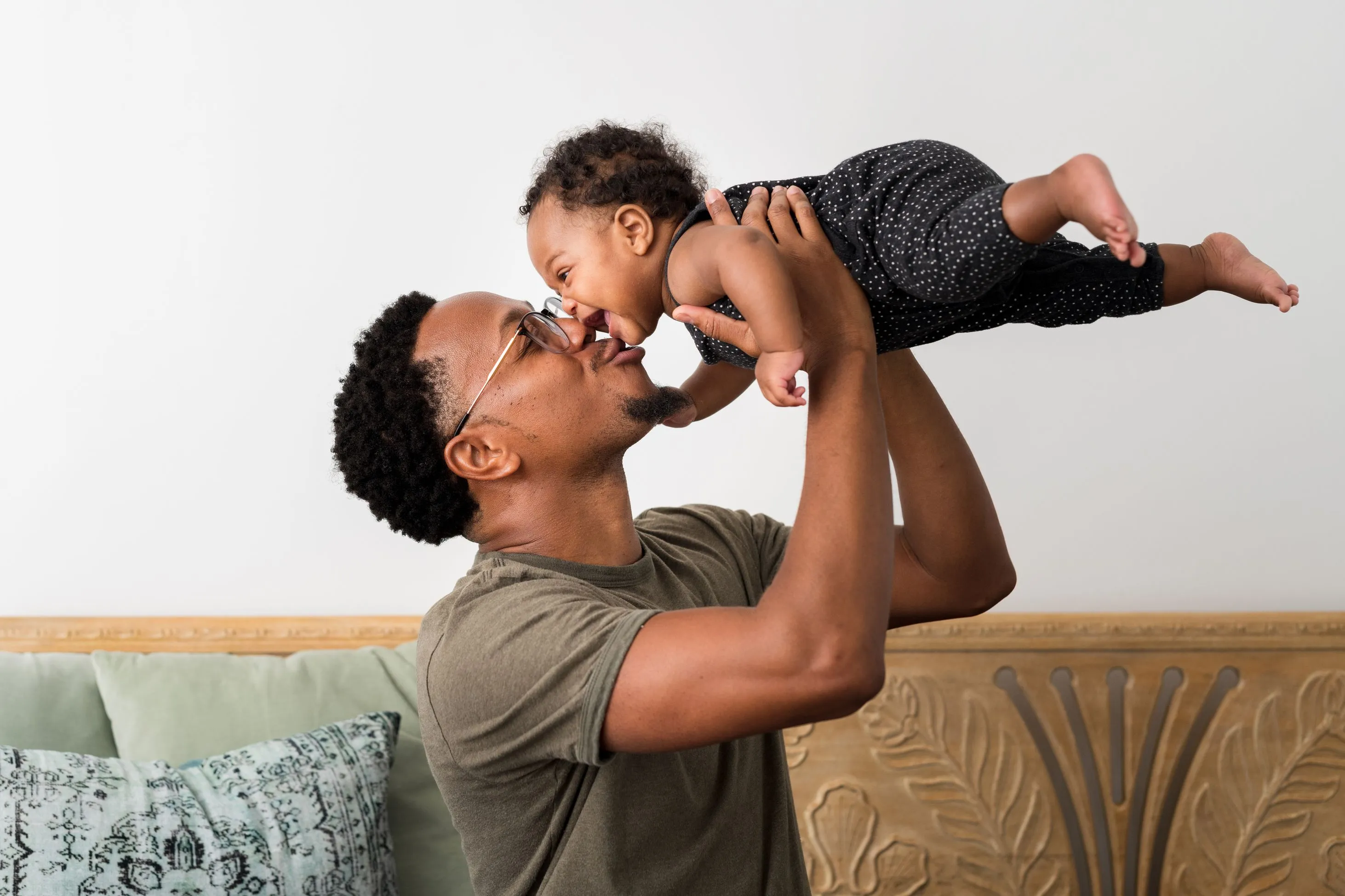 Father and baby playing